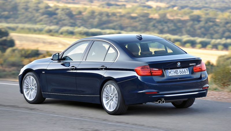 2012 BMW 3 Series Luxury Line Rear 3/4 View (Action)