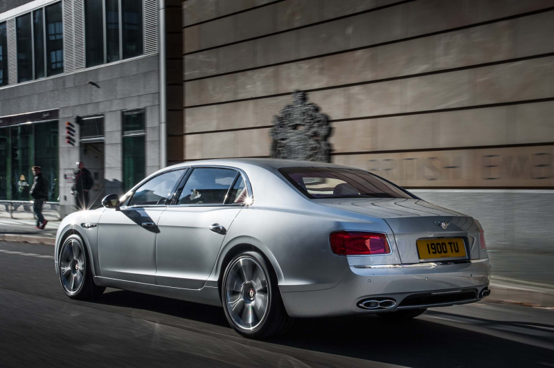 2015 Bentley Flying Spur V8 rear three quarters in motion